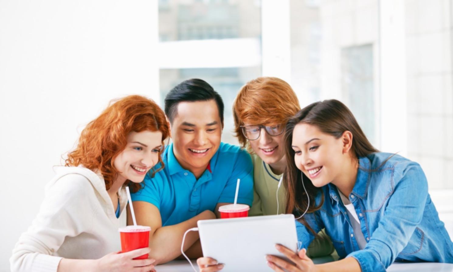 Professional analyzing financial charts and market data on multiple screens